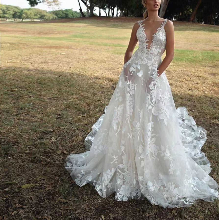 Women's V-Neck Sleeveless Lace Flowing Wedding Gown – Elegant Bridal Dress