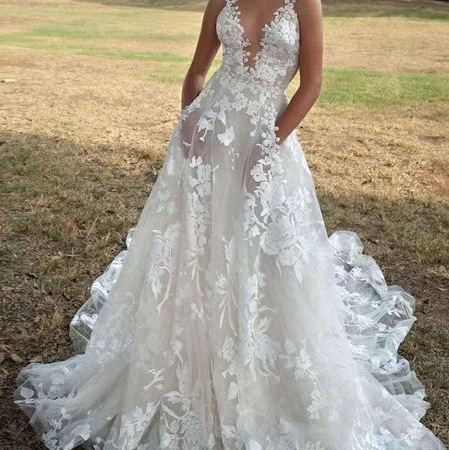 Women's V-Neck Sleeveless Lace Flowing Wedding Gown – Elegant Bridal Dress